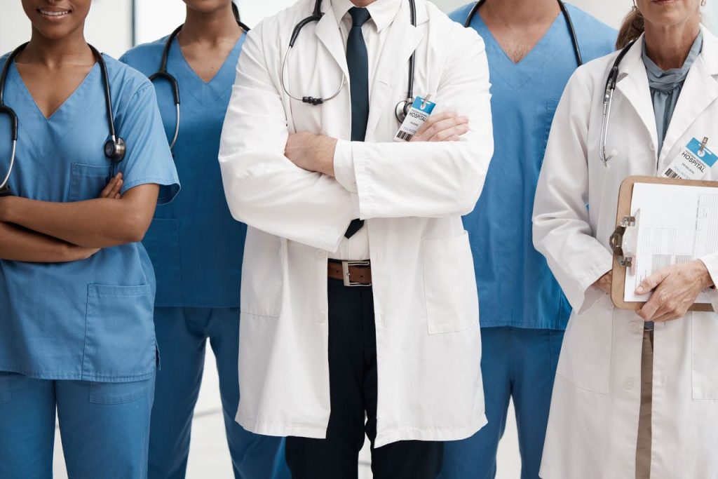 Medical staff in scrubs and lab coats